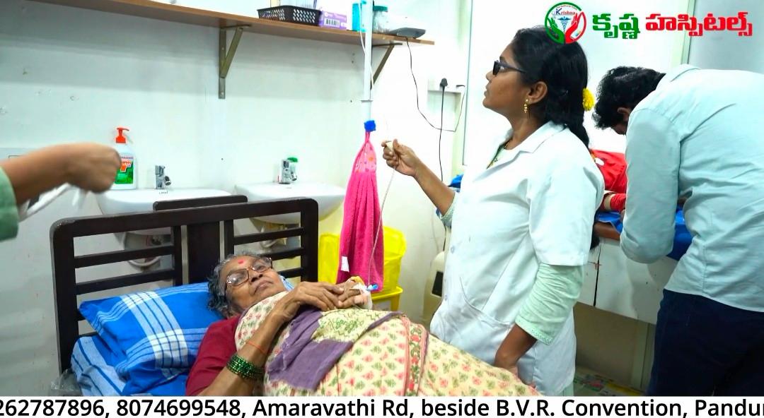 Doctor Monitoring Patient at Krishna Hospitals
